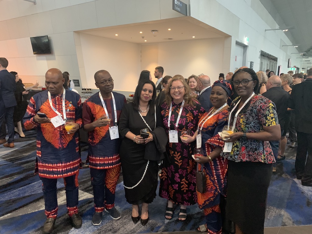 A group of family doctors from around the world, some in traditional dress, at a WONCA Sydney 2023 reception